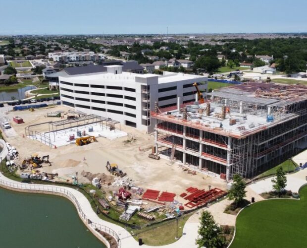 6-story parking garage and 5-story building in co-op district Hutto