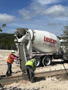 Marcos Suaste Superintendent Guides Concrete into Forms