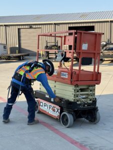 BCS Worker Inspects Scissor Lift as part of Operator Training