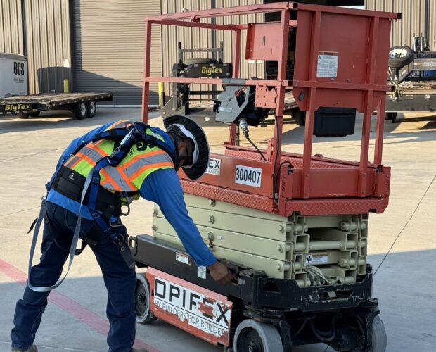 BCS Worker Inspects Scissor Lift as part of Operator Training