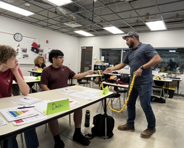 Falltech Trainer Eduardo Cortes teaches students about Fall Protection